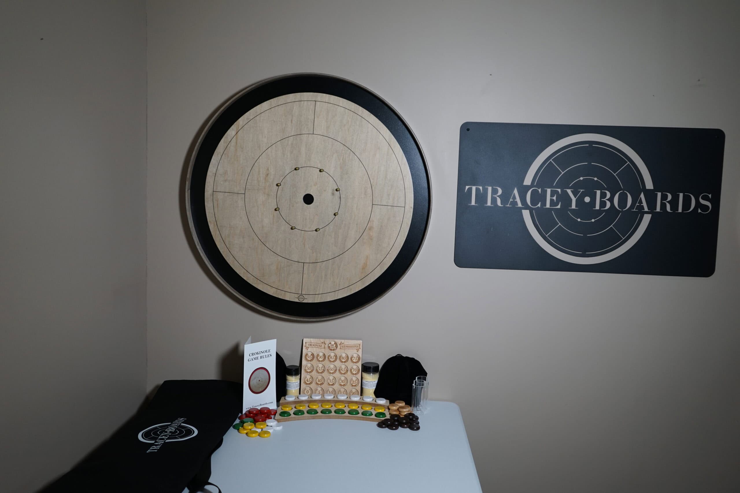 a grey rock crokinole board on a wall mount